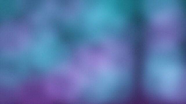 Abstract purple and blue bokeh background, soft out of focus light leaks, dreamy ethereal gradient motion for cinematic video overlays