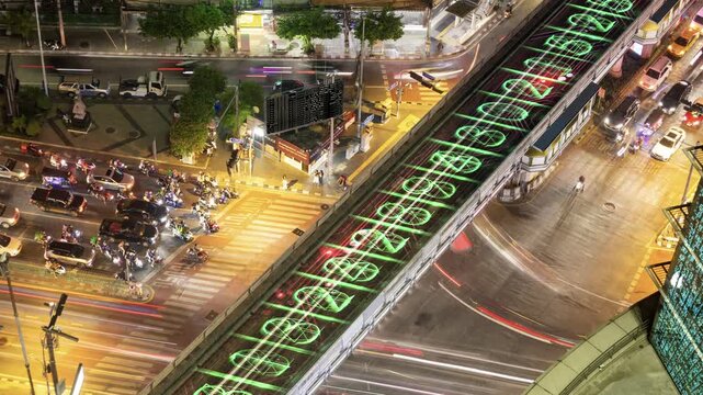 traffic in central bangkok with code and data overlayed in the buildings 