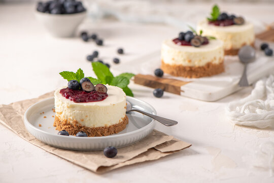 Mini cheesecakes with blueberry compote and fresh mint