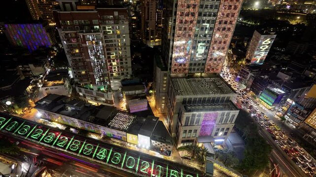 traffic in central bangkok with code and data overlayed in the buildings 