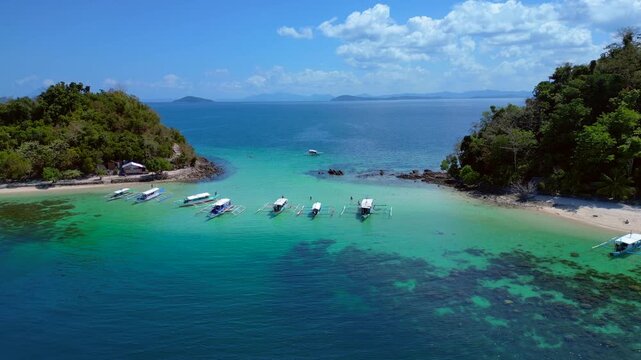 Palawan island hopping with traditional bangka boats. Amazing aerial view drone