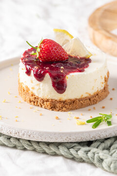 Mini cheesecake topped with a sweet strawberry jam