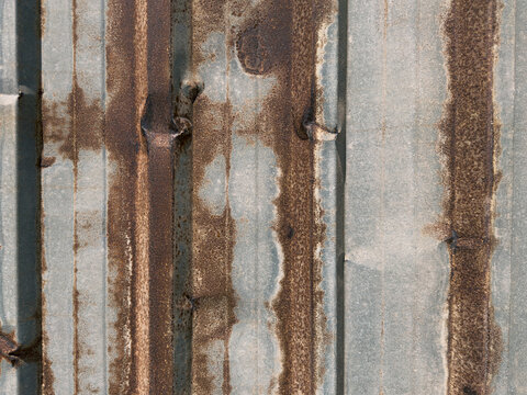 Rusty corrugated metal sheet background texture surface