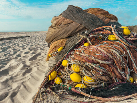Traditional Arte Xavega fishing nets on sandy beach