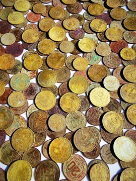Vintage Soviet Union coins background. Heap of ancient USSR copper bronze and nickel kopeck coins with rich patina close-up.