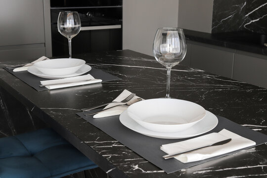 Table setting on black marble countertop