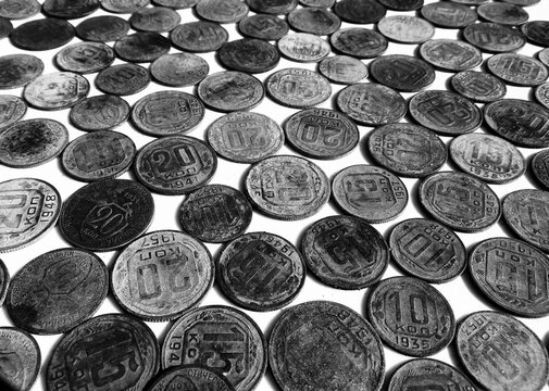 Monochrome Soviet Union coins texture. Black and white background with ancient USSR kopeck currency and historical money pattern close-up.