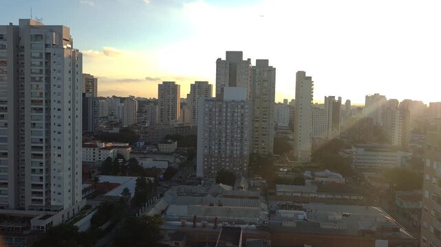 Sunset between buildings in the Lapa neighborhood of Sao Paulo.