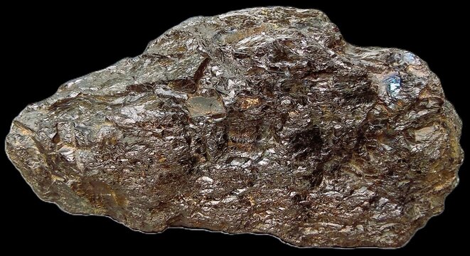 Raw iron ore mineral specimen. Authentic brown limonite stone and hematite nugget isolated on black background.