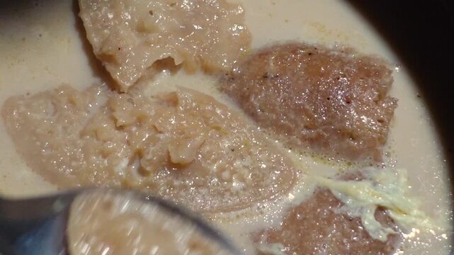 Date juice was cooked and turned red, and the Chitai Pitha was dipped in it, now milk is poured into it, which will be called Dudh-Chitai Pitha.