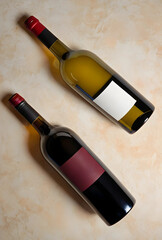 Obraz premium Two wine bottles, one red and one white, with blank labels for branding, on a light marble background, top view