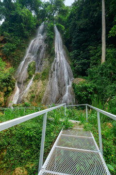 Scenic Namtok Waterfall Pathway Behind Lush Green Gorge Landscape