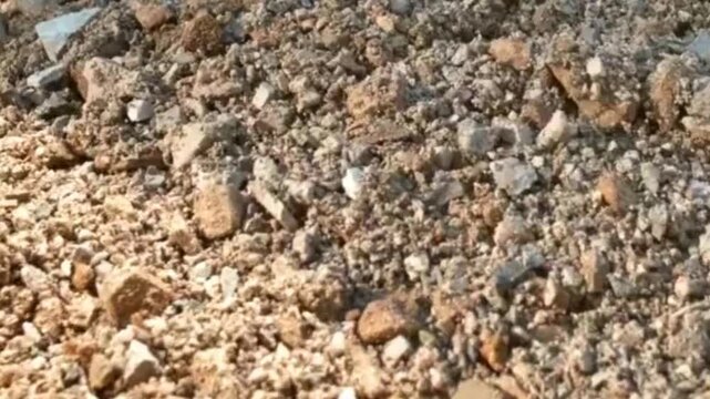 Close-up of Natural Dry Earth and Stones on a Sunny Day