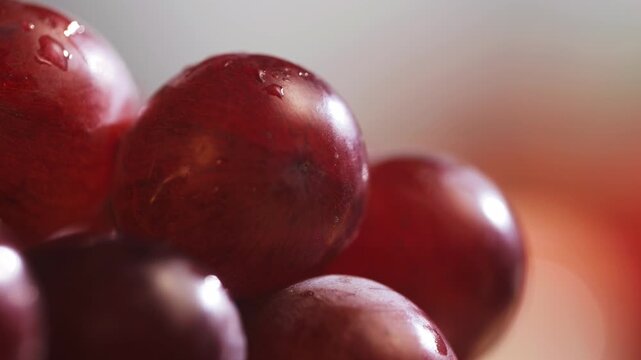 Red grape, spanish supermarket food, Close-up green grape cluster on vine in the vineyard. Stock Photo