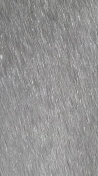 Heavy Rain Falling Against Gray Background