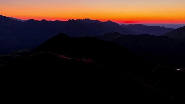 Aerial Orbit Around Lone Hiker at Sunset on Col d'Aubisque Mountain Ridge, French Pyrenees, France