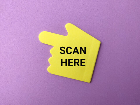 A yellow hand-shaped pointer pointing left displays SCAN HERE text against a solid purple background