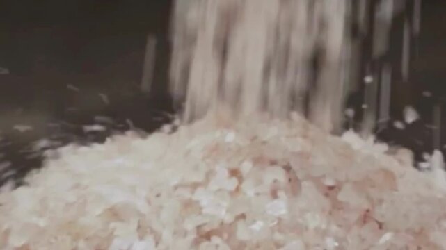 Pink Himalayan Salt Falling onto a Pile