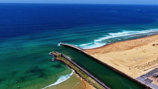 Aerial view of the port of Capbreton with surfers and sandy beaches in France