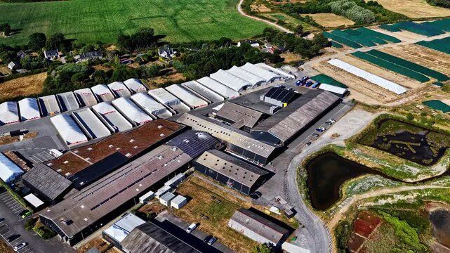 Aerial view of Guerande salt marshes and industrial buildings in France