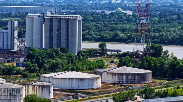 Industrial area with silos and fuel tanks along the Garonne river in Bordeaux, France