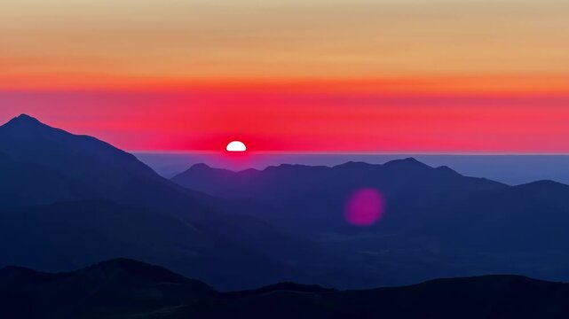 Colorful sunset dropping behind the Pyrenees mountains from Col d'Aubisque, France