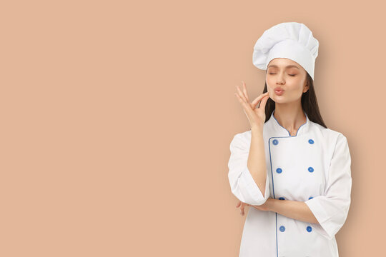 Young woman in chef outfit enjoys her time in the kitchen