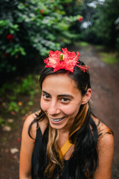 Laughing, flower on head