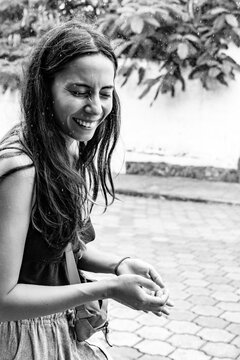 Woman laughing in the rain