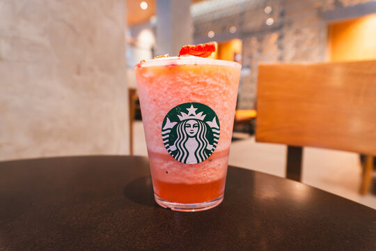 Strawberry Cream Frappuccino Blended Beverage topped with Whipped Cream and Fresh Strawberry Slice at Starbucks, Bangkok Thailand on July 2026
