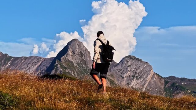 Aerial Drone Tracking Hiker Piloting Drone on Col d'Aubisque Mountain Ridge, French Pyrenees