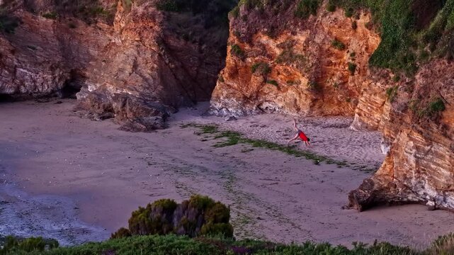 Person stretching and exercising on Plage des Oc&eacute;anides in Capbreton, France