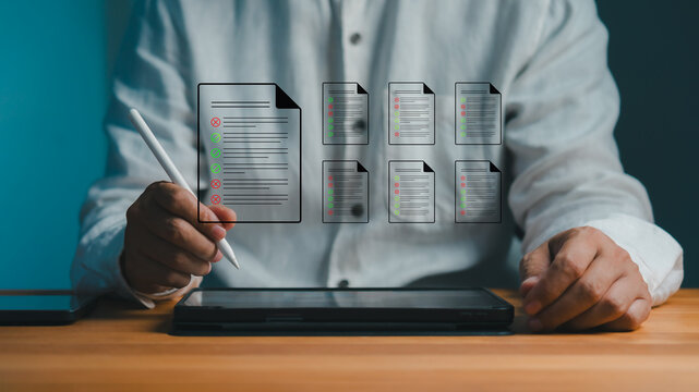 Professional man uses a digital pen for an online signature on a smart form. This modern technology provides paperless management of a business document and contract approval.