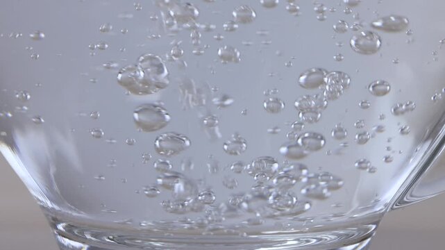 Sugar Crystals Dissolving in a Glass Mug of Hot Water
