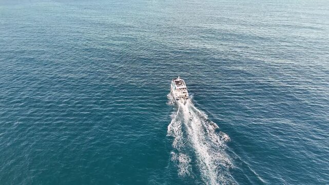 Aerial View of Ferry Boat Cruising Through Blue Ocean Water