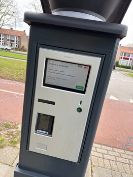 rotterdam, netherlands - april 05 2026: A payment station for public parking is located in rotterdam