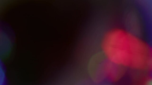 Round glow. Blur lens light. Defocused blue red multicolor sparkle shine flare flicker beam gleam on abstract art dark background.