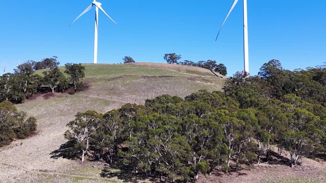 Wind Turbines Spinning on Rural Hillside in New South Wales