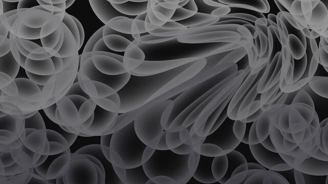 Abstract organic shapes forming with translucent bubbles in dark macro lighting