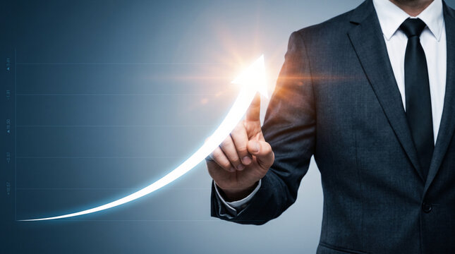 Business man in suit touching digital upward trending arrow growth graphic