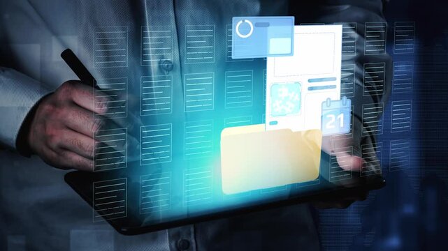 Business Professional Utilizing Futuristic Technology to Manage Digital Files and Data on a Tablet with Interactive Interface and Visual Elements. Entropy.