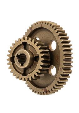 Two old bronze metal gears connected together as a mechanical part for industrial machine isolated on transparent background