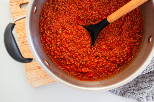 homemade vegetarian lentil bolognese sauce in big pot on kitchen counter