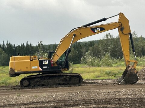 Cat tractor, heavy equipment machine Displayed in a forest, woodland setting in Alberta, Canada. August 2, 2026. Grande Prairie, Alberta, Canada. For editorial use only.