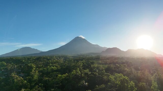 Aerial footage of Mount Merapi and Mount Merbabu in the morning. Blue skies and clear weather. Tropical landscape.