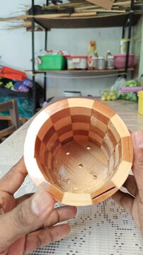 Hand Showing Handcrafted Woven Bamboo Utensil Holder