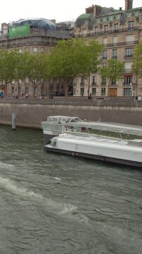 Sightseeing Cruise Boat Navigating the Seine River in Paris