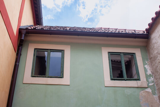 Quaint little windows in a colourful building in europe; architecture, building, windows, cute