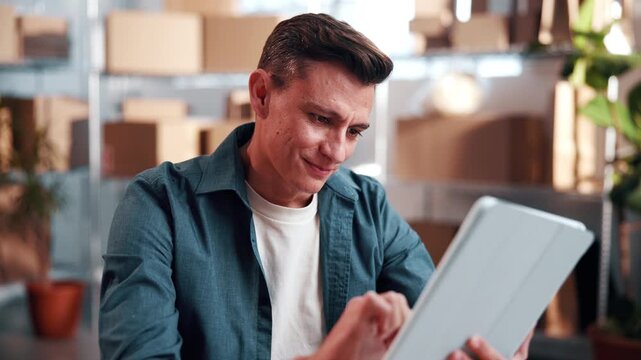 Smile, man and ecommerce startup with tablet, research and confirm order for stock control. Male person, review and website in office with digital, inventory availability and catalog for distribution