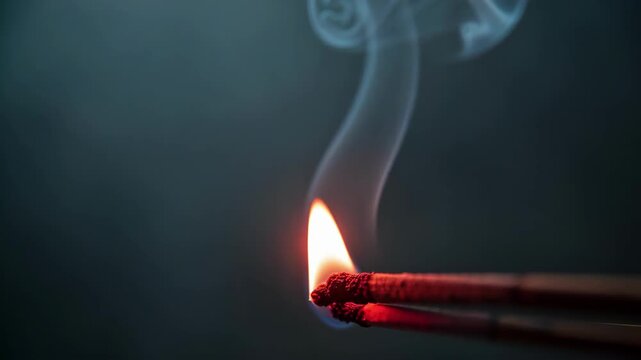 Burning Matchstick With Rising Smoke.